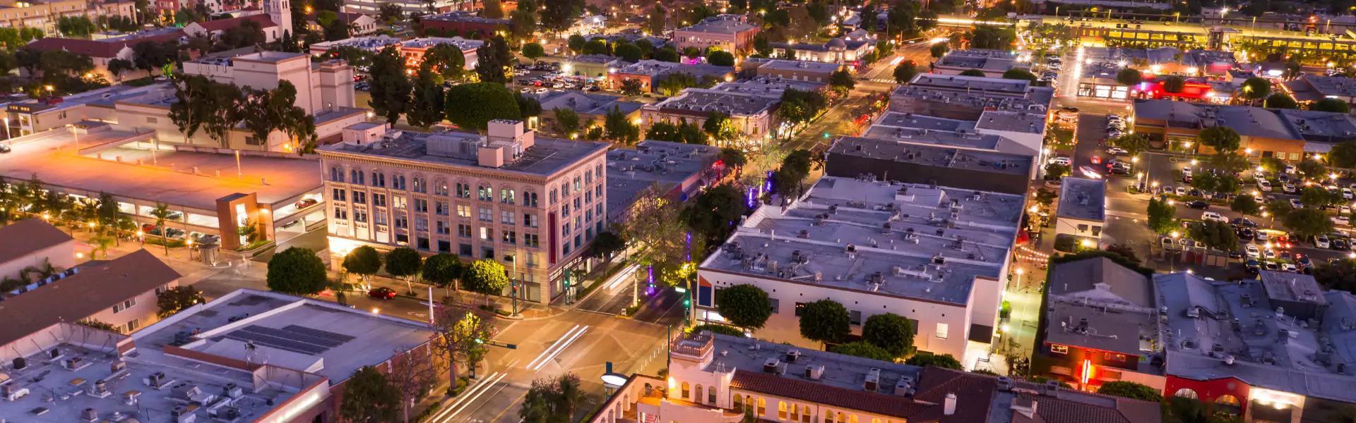 Aerial view of a vibrant urban night scene.