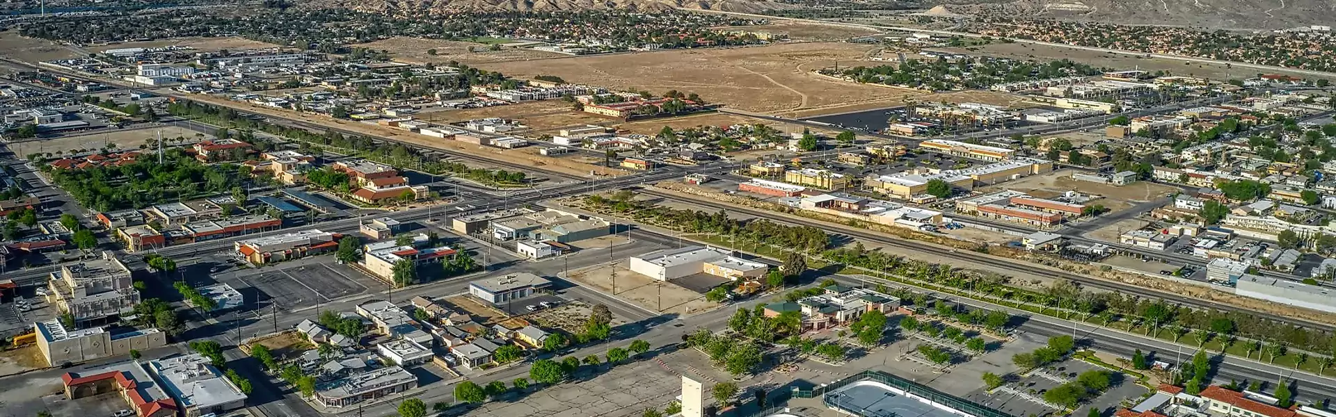 Aerial view of a suburban landscape with roads.