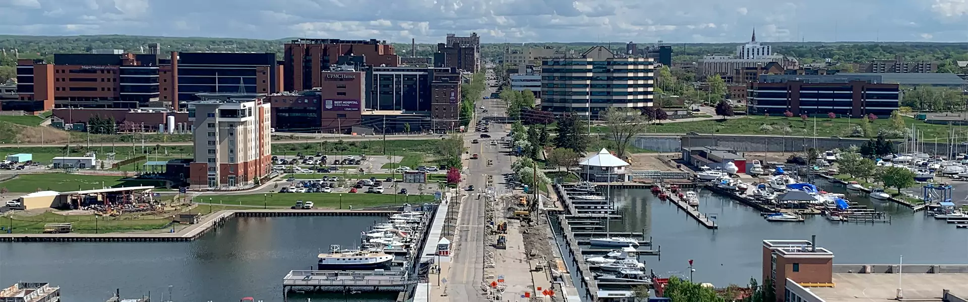 Aerial view of a waterfront city with buildings.
