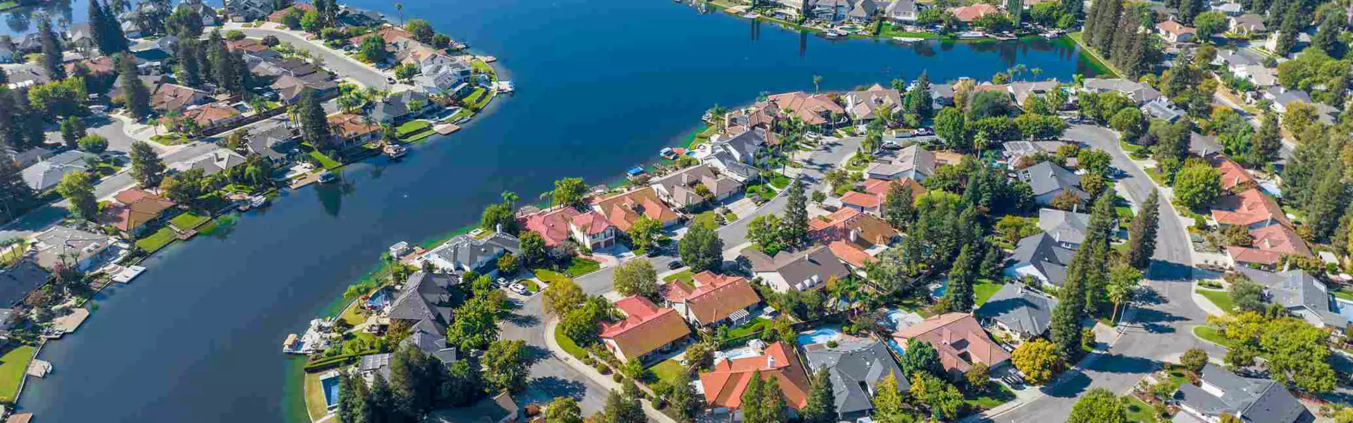 Aerial view of a picturesque lakeside neighborhood.