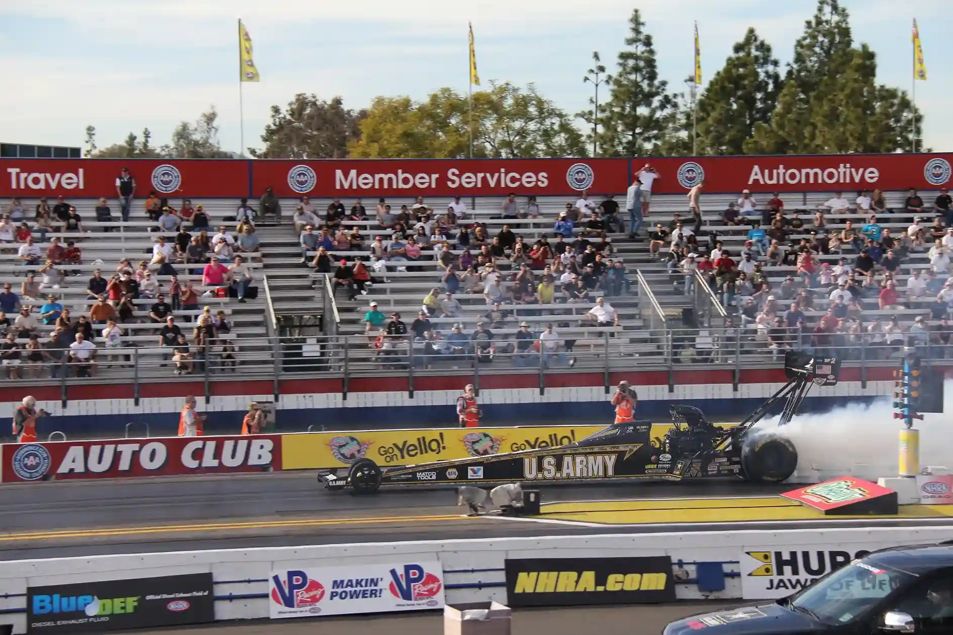 Dragster racing at an auto club event.