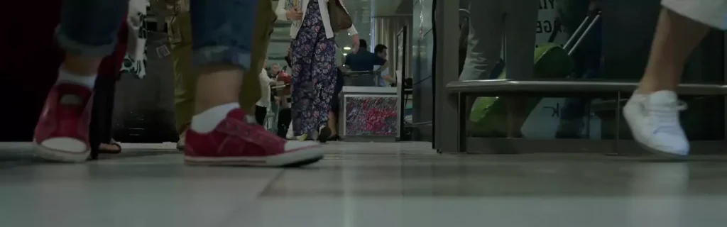 People walking in a busy indoor space.