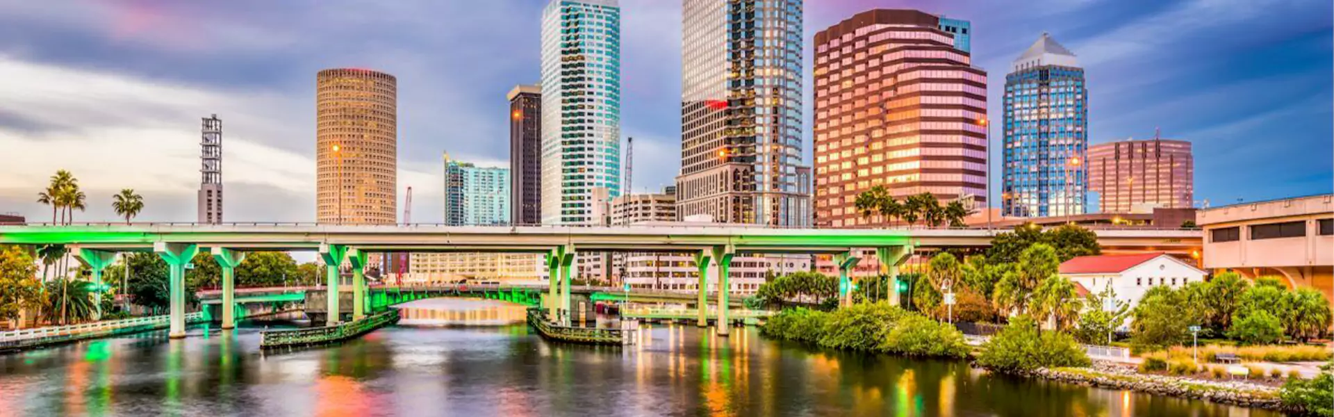 Tampa skyline with bridge and waterfront views.