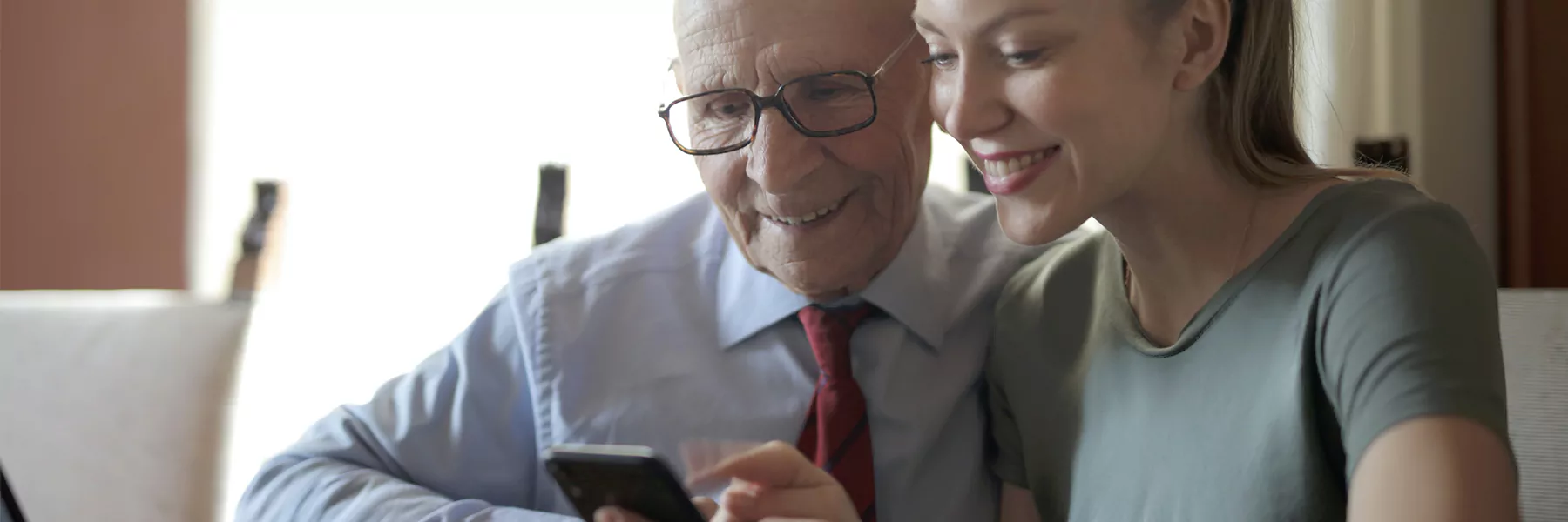an older person (or people) using a computer phone