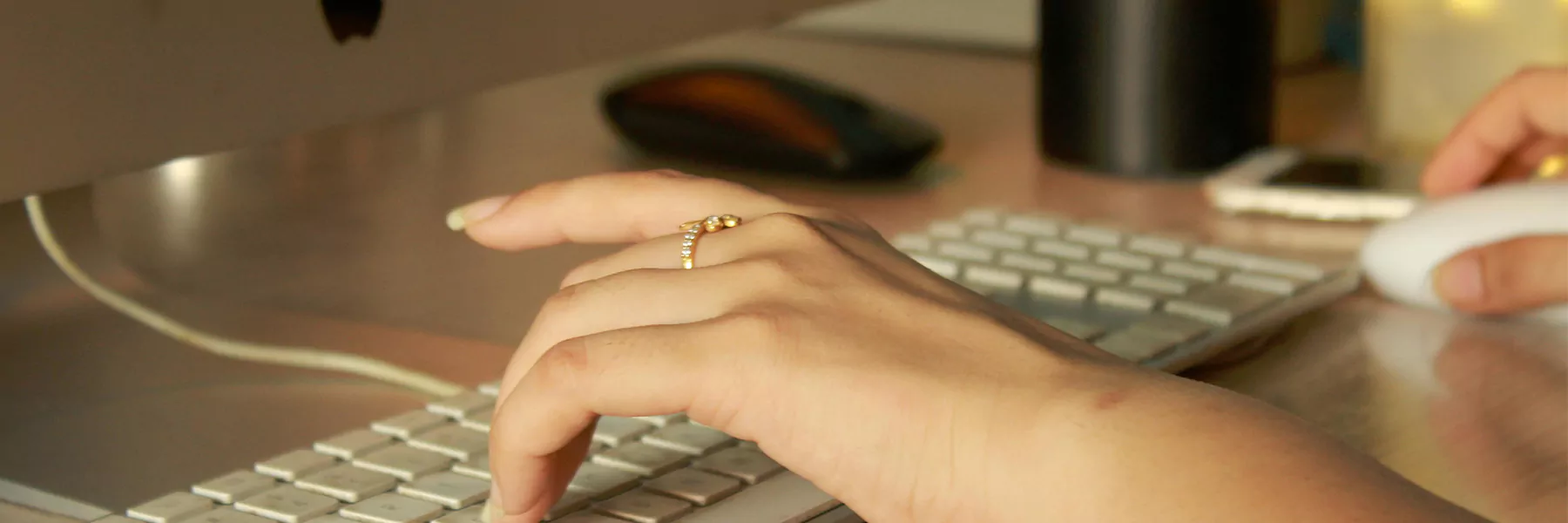 fingers on computer keyboard
