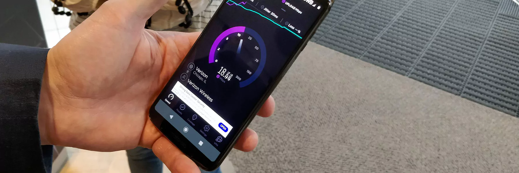 someone using a 5g phone; or someone looking at multiple phones