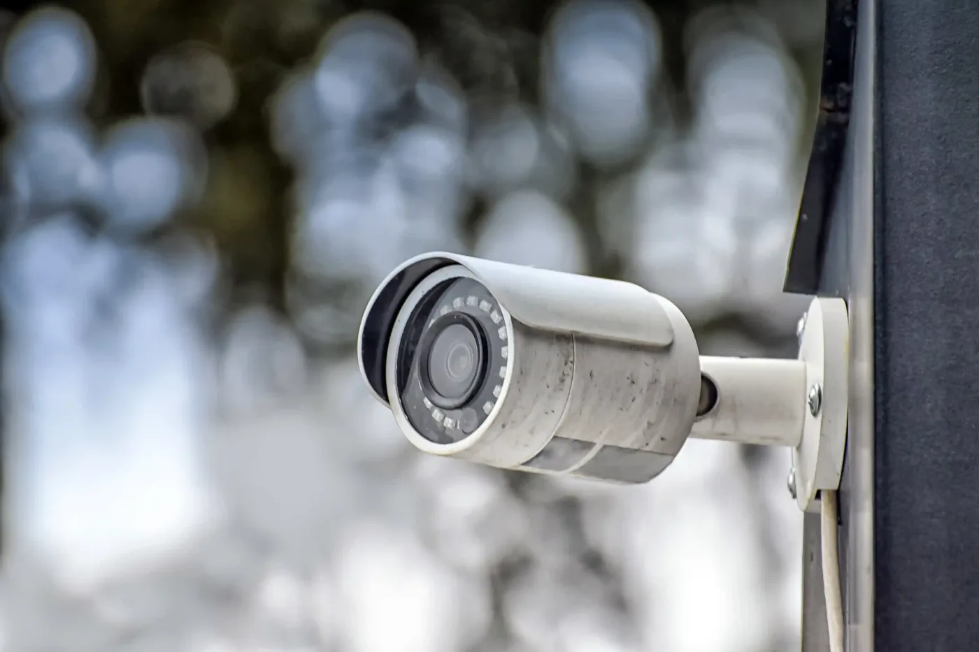 Close-up of a security camera on a wall