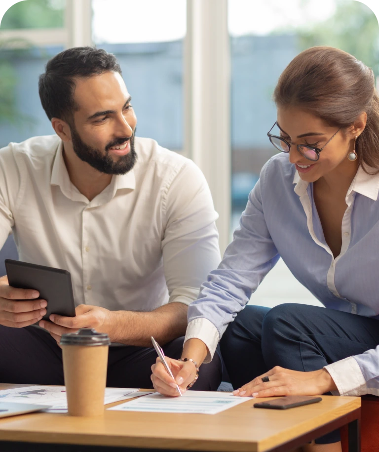 Two colleagues collaborating on a project together.